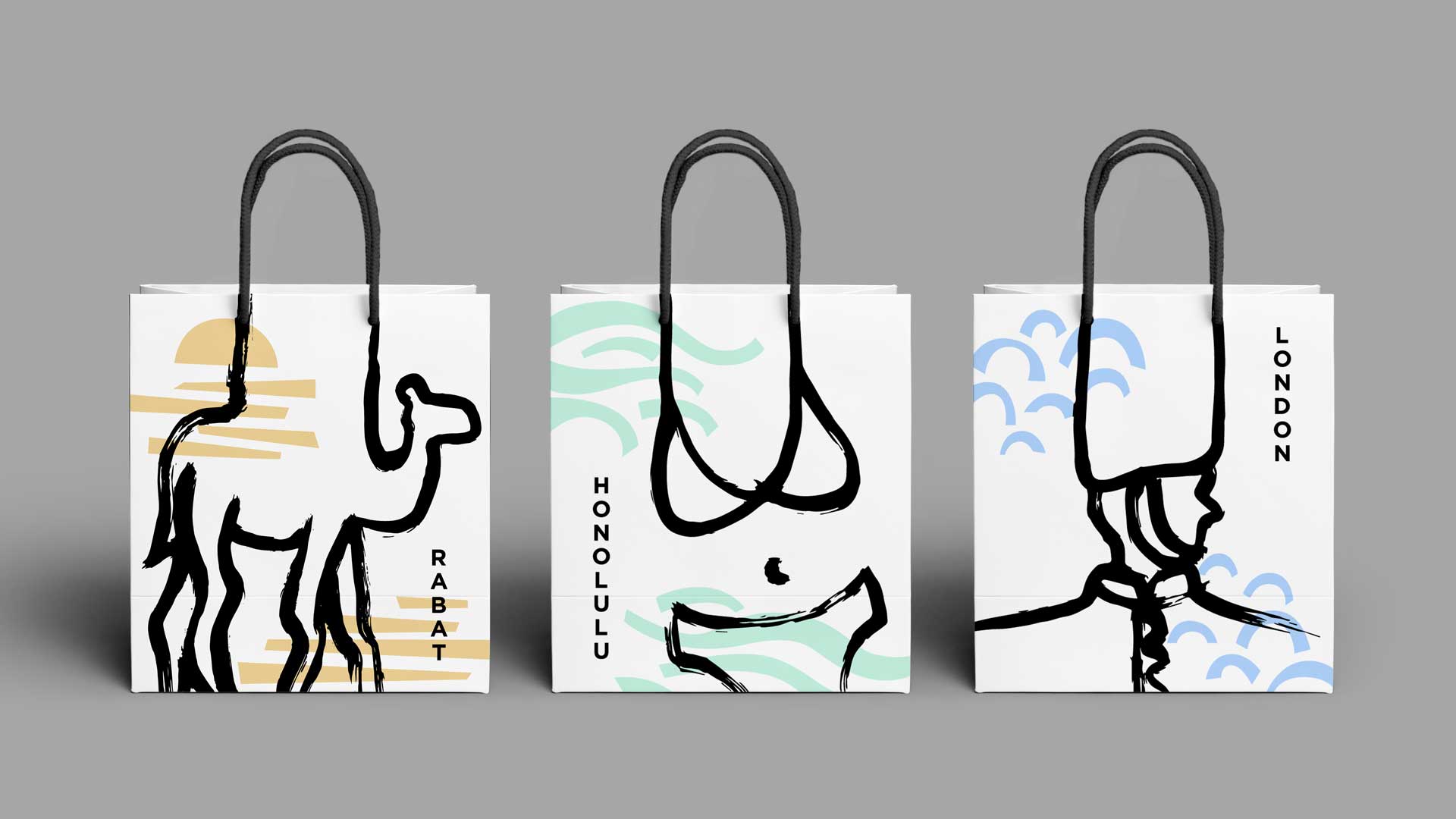 Three shopping bags with black line drawings. The line drawings connect to the bag handles creating a camel for Rabat, a swimsuit for Honolulu and the hat on a guard for London.