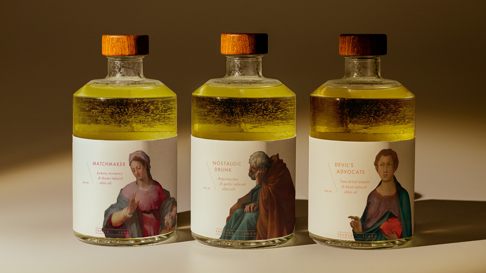 Three Tavolo Lungo branded olive oil packages.