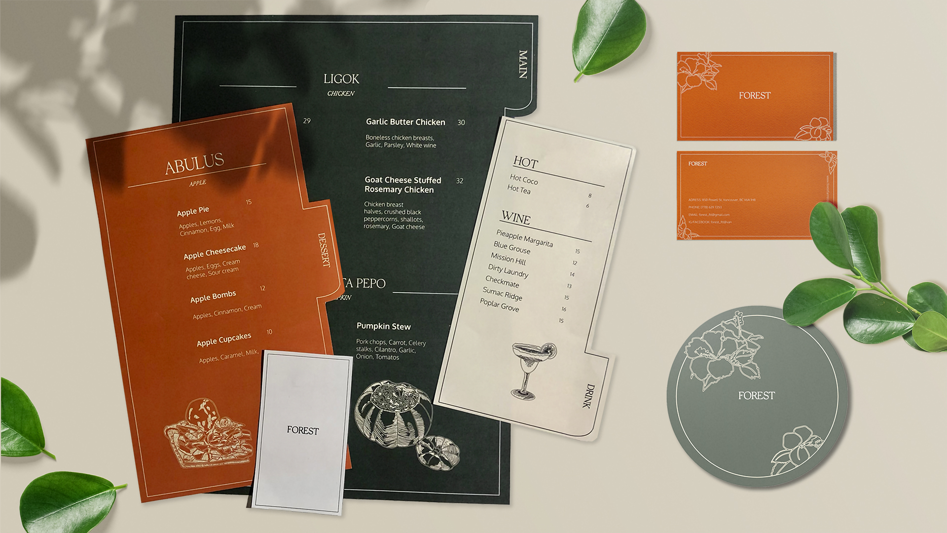 A display of farm-to-table restaurant menus, coaster, and business card.