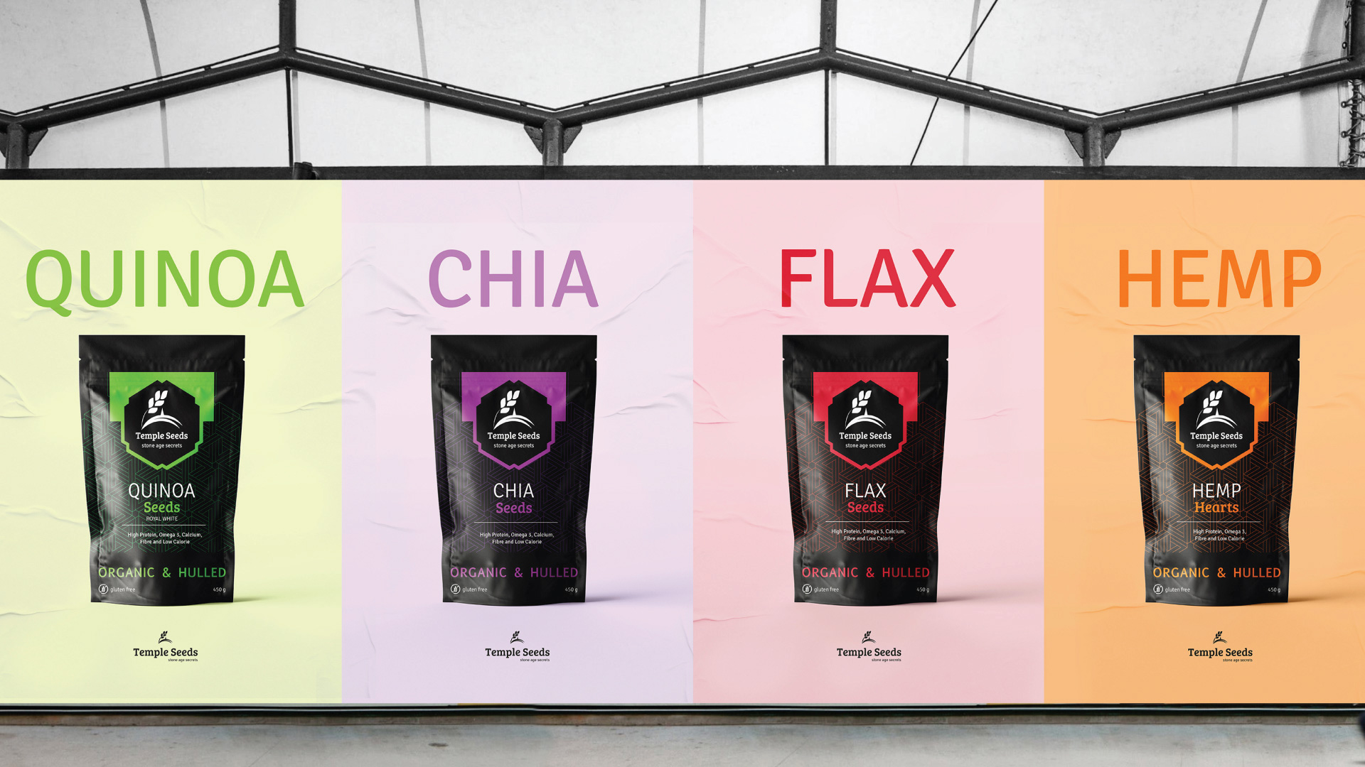 4 Posters of single packages of seeds. The quinoa is in green, chia in purple, flax in red and hemp in orange